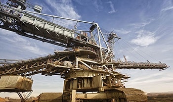 The Energy Cost of Friction and Wear in Mining