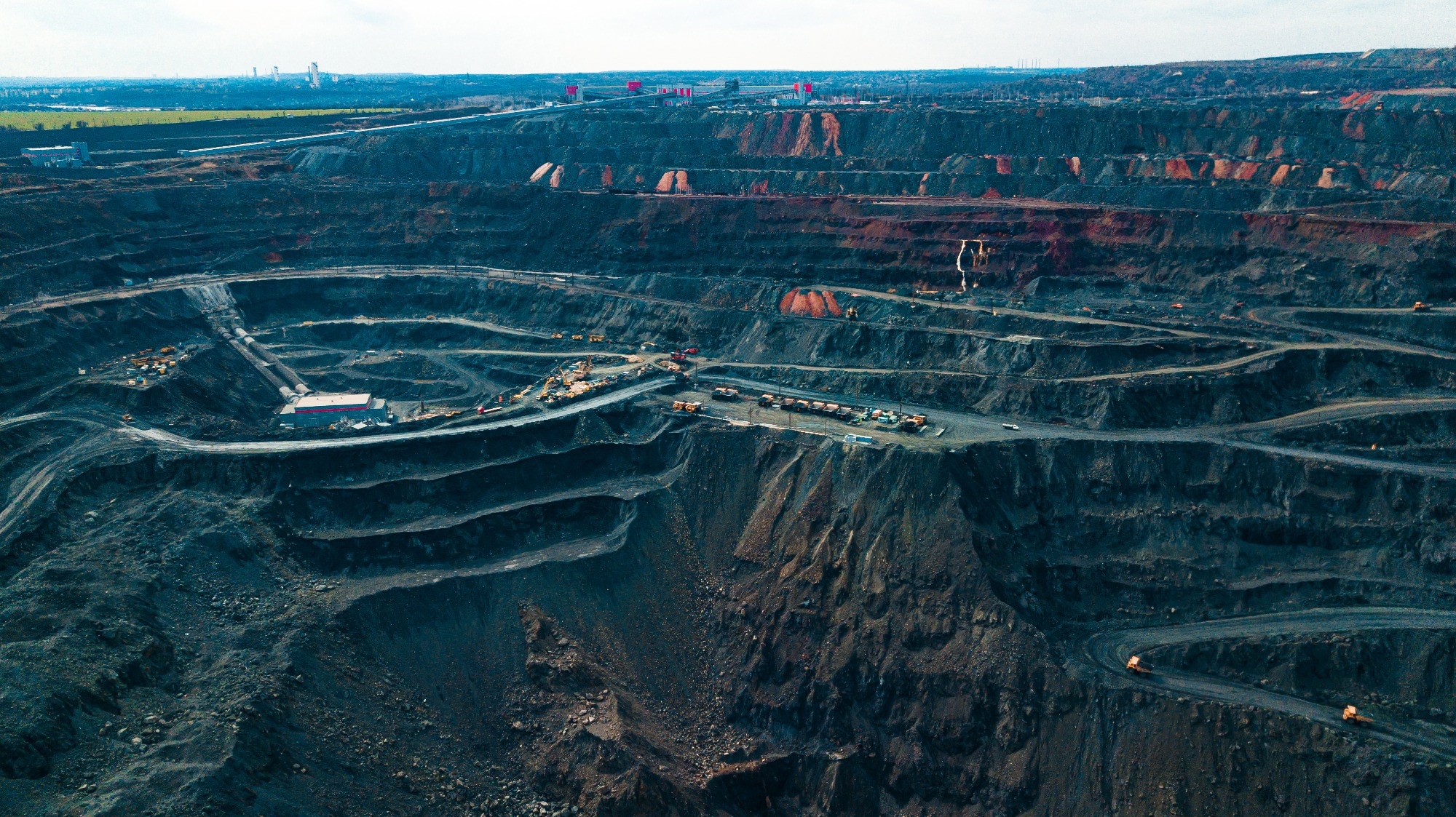 Aerial view of the Iron ore mining, Panorama of an open-cast mine extracting iron ore, preparing for blasting in a quarry mining iron ore, Explosive works on open pit
